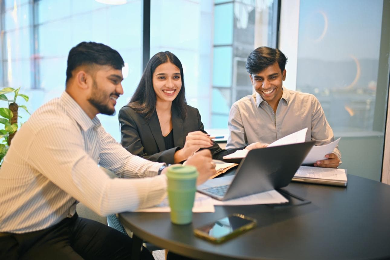Early-stage Indian founders reviewing business plans around a table
