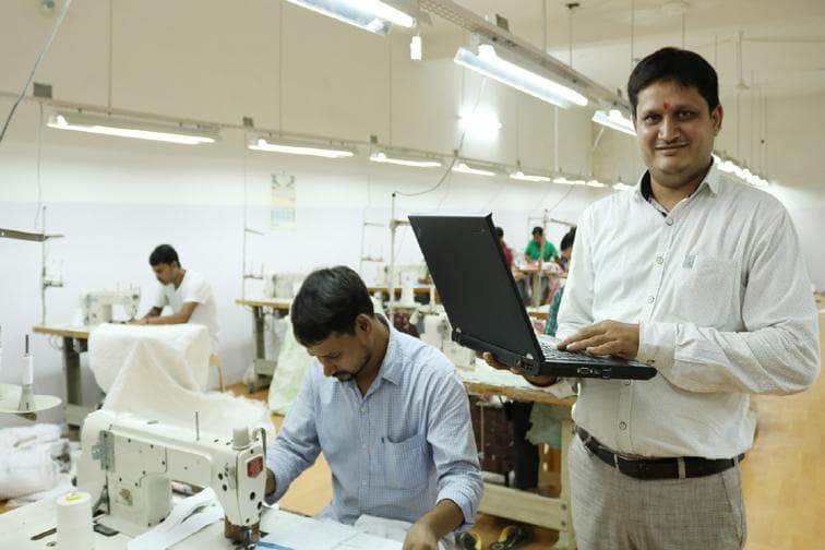 A small manufacturing business owner on the factory floor