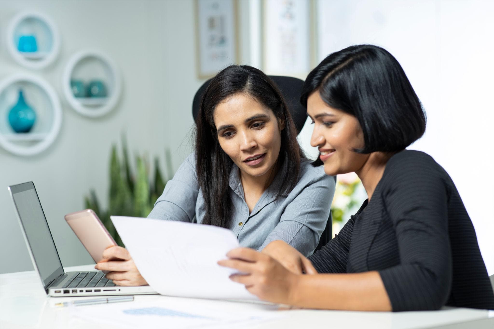 An advisor explaining scheme options to a business owner